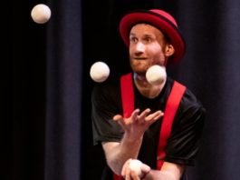 Circus performer Janoah Bailin will teach you how to juggle as ze unicycles, balances, juggles, tells jokes and stories, and dances, featuring the scarves, and other juggling props. Photo by Roy Knight.