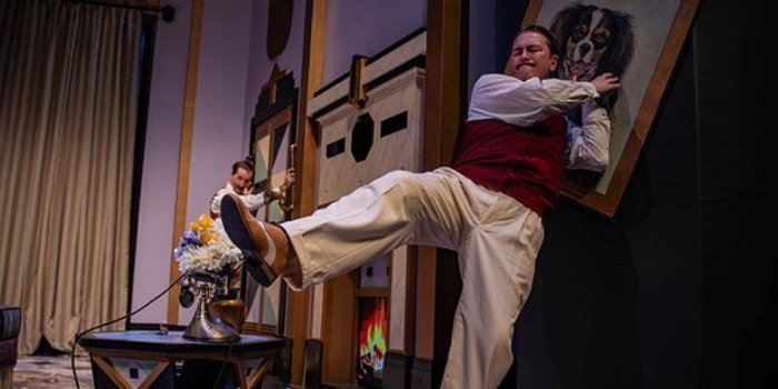 Slowly but surely, John Dinning's set begins to fall apart around the actors in The Play That Goes Wrong in this photo by Stoo Metz.
